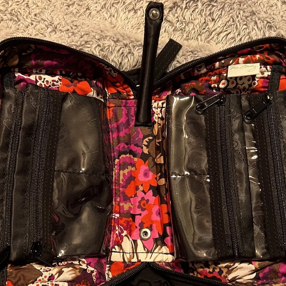 Vera Bradley black toiletry bag with 4 zippered pockets inside. Great condition!